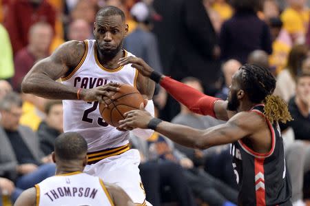 May 17, 2016; Cleveland, OH, USA; Cleveland Cavaliers forward LeBron James (23) drives against Toronto Raptors forward DeMarre Carroll (5) during the third quarter in game one of the Eastern conference finals of the NBA Playoffs at Quicken Loans Arena. The Cavs won 115-84. Mandatory Credit: Ken Blaze-USA TODAY Sports