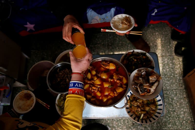 The Wider Image: 'I've let them down': Beijing's migrant workers miss family reunions on Lunar New Year