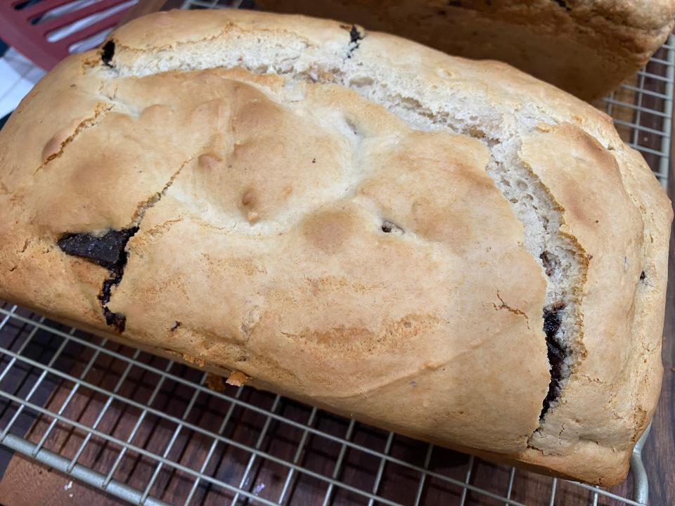 baked chunky money ice cream bread on a metal cooling rack