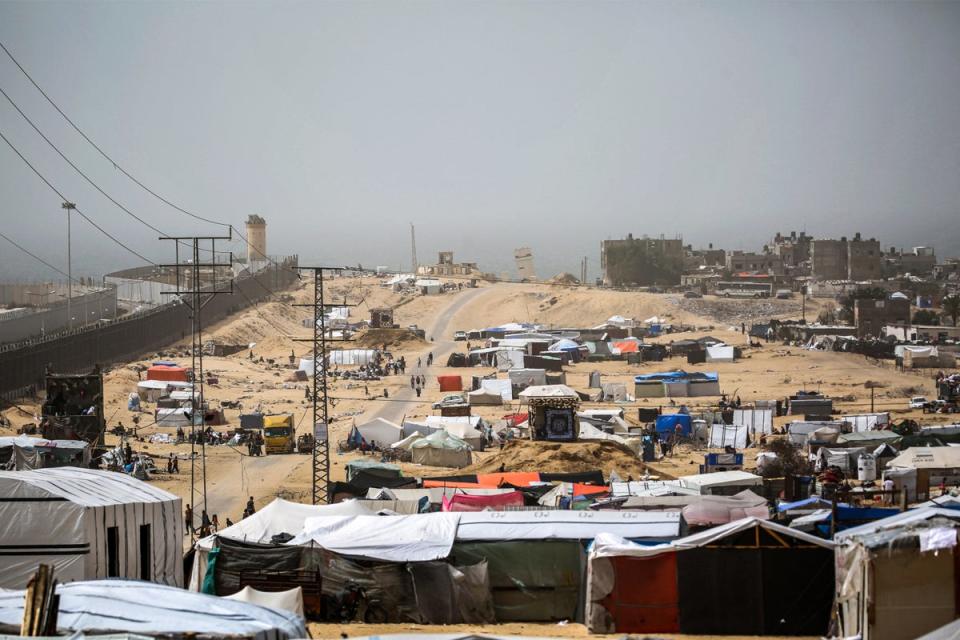 Tent encampments housing displaced Palestinians in Rafah, in the southern Gaza Strip, by the border fence with Egypt (AFP via Getty)