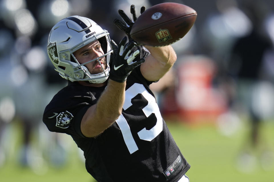 Las Vegas Raiders wide receiver Hunter Renfrow (13) practices during NFL football training camp Tuesday, Aug. 23, 2022, in Henderson, Nev. (AP Photo/John Locher)