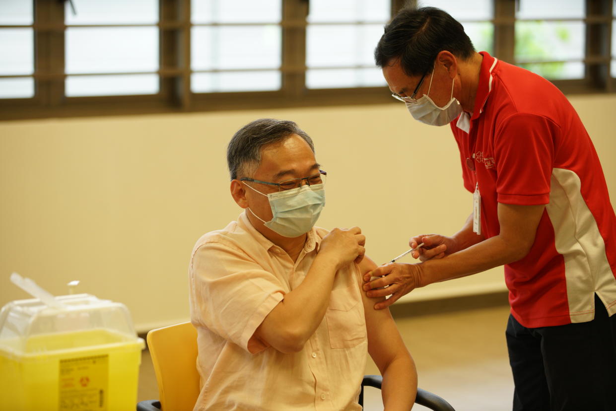 Health Minister Gan Kim Yong receives his first dose of  COVID-19 vaccination at Kwong Wai Shiu Hospital. (PHOTO: Ministry of Communications and Information)