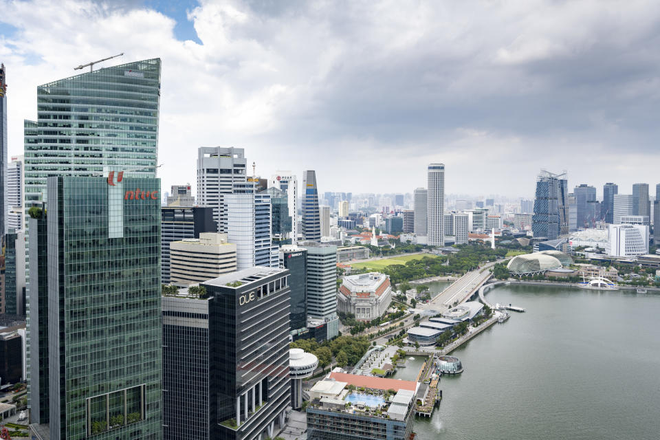 Aerial view of skyscrapers seen in the financial district of Marina Bay in Singapore. Most of these skyscrapers are offices occupied by international banks. Seen a cloudy afternoon.