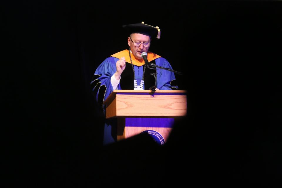 College president David Roland Finley addresses the crowd and graduating Class of 2022 during North Central Michigan College's graduation ceremony.