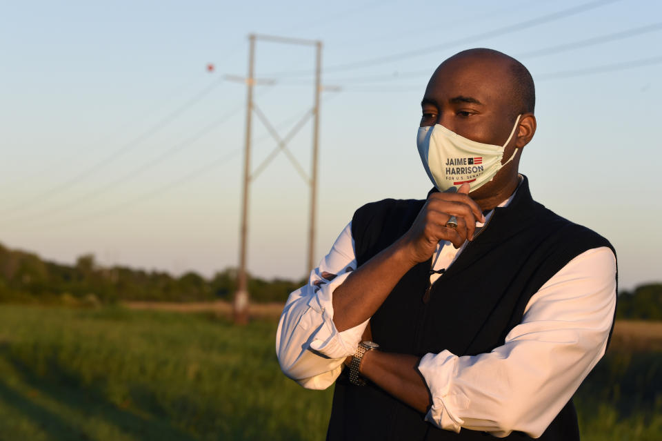 Democratic U.S. Senate candidate Jaime Harrison speaks to reporters after a drive-in campaign rally on Saturday, Oct. 17, 2020, in North Charleston, S.C. (AP Photo/Meg Kinnard)