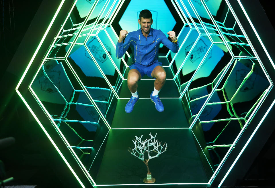 Djokovic poses with yet another Paris Masters trophy. (Dean Mouhtaropoulos/Getty Images)