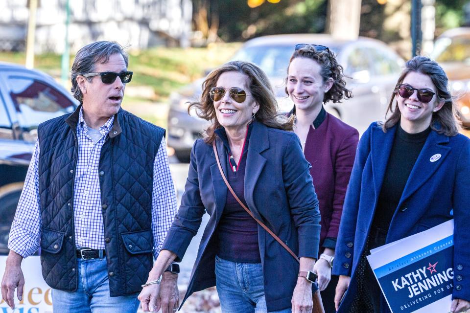 Attorney General Kathy Jennings, her husband Dave White, at left, and team members arrive to cast their votes in the midterm elections at Immanuel Church Highlands in Wilmington, Tuesday, Nov. 8, 2022. 