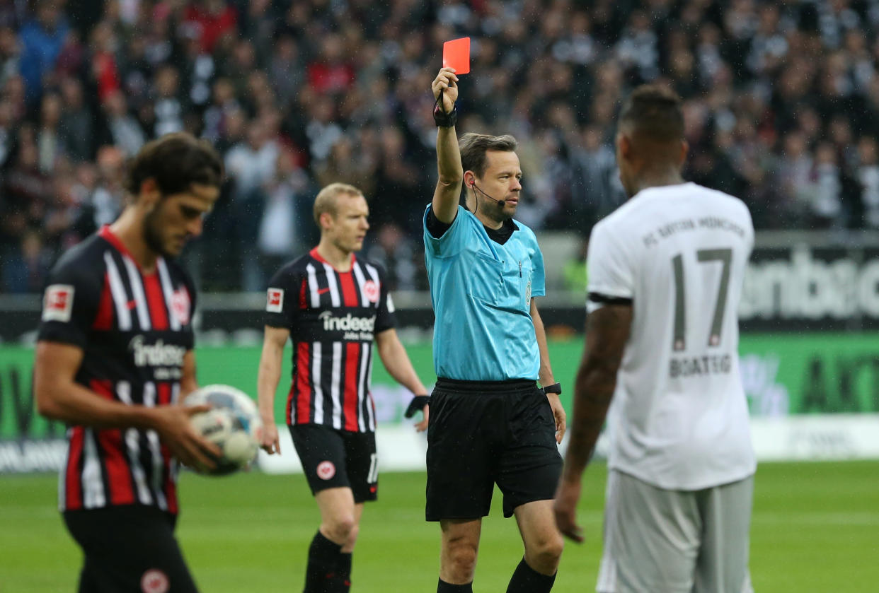 Bayern Munich's Jerome Boateng (17) is shown a red card during Eintracht Frankfurt's 5-1 victory on Saturday. (Getty)