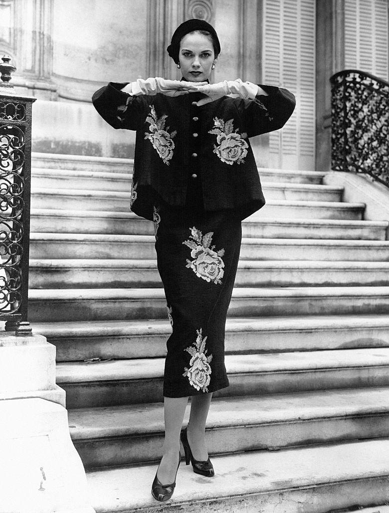 <p>A model wearing a needlepoint rose-print ensemble from the house of Hubert de Givenchy. </p>