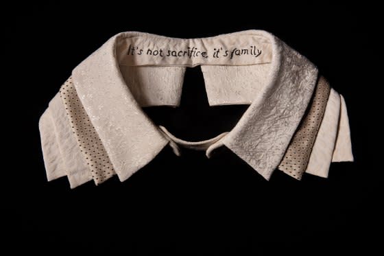 Female-founded fashion company M.M. LaFleur was commissioned to create this collar, which is inscribed with the words of Ginsburg's husband Marty, "It's not sacrifice, it's family". <span class="copyright">Elinor Carucci for TIME</span>