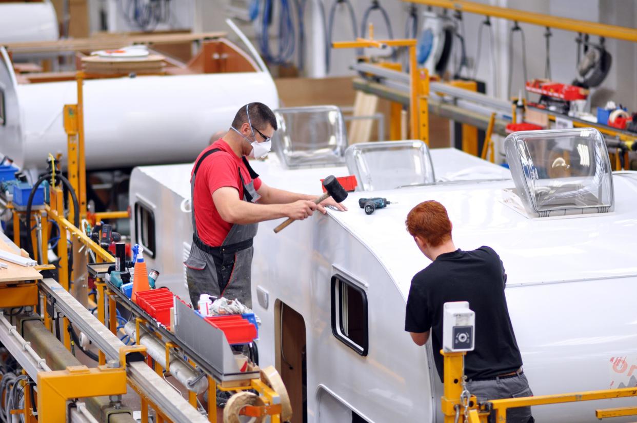 Berlin, Germany - June 08, 2012: quality control of finished assembly of motorhomes / camper vans in the production line in a factory