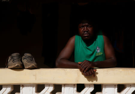 Bubacar Samba, a Gambian migrant who voluntarily returned from Libya, looks on as he stands at his home in Brikama, Gambia April 5, 2017. REUTERS/Luc Gnago