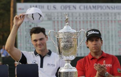 Martin Kaymer and Erik Compton pose with trophy after Kaymer won the U.S. Open. (AP)