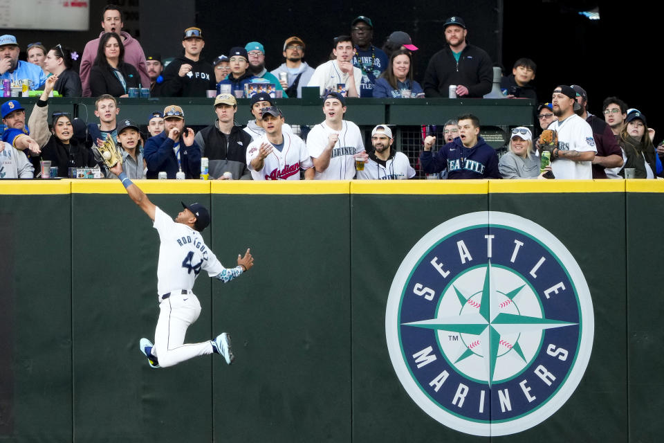 Seattle Mariners center fielder Julio Rodríguez makes a leaping catch on a fly ball hit by Cleveland Guardians' Will Brennan during the second inning of a baseball game Monday, April 1, 2024, in Seattle. (AP Photo/Lindsey Wasson)