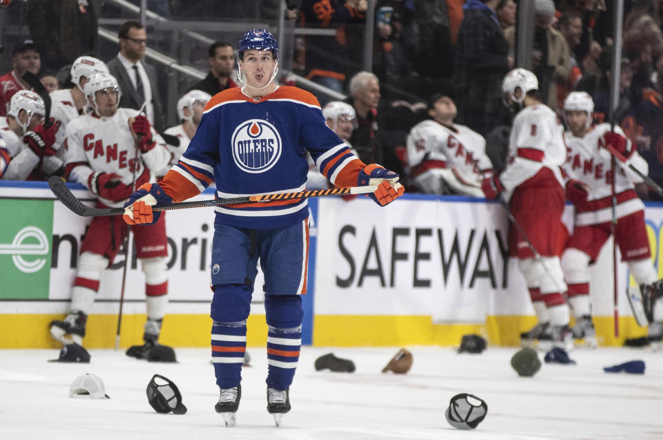 Edmonton Oilers' Zach Hyman (18) celebrates his hat-trick goal against the Carolina Hurricanes during the third period of an NHL hockey game Wednesday, Dec. 6, 2023, in Edmonton, Alberta. (Jason Franson/The Canadian Press via AP