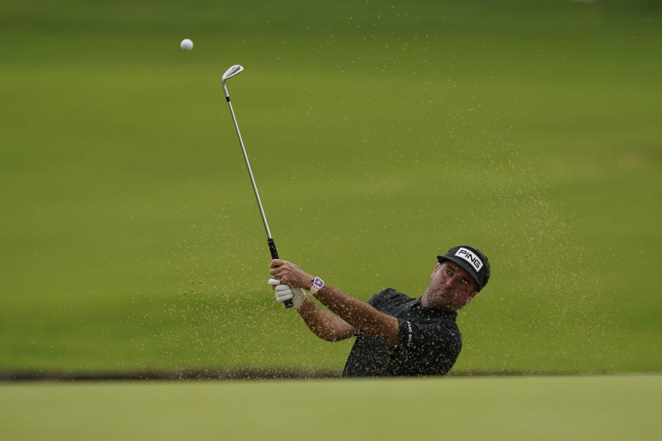 Bubba Watson hits from the bunker on the second hole during a practice round for the PGA Championship golf tournament, Tuesday, May 17, 2022, in Tulsa, Okla. (AP Photo/Eric Gay)