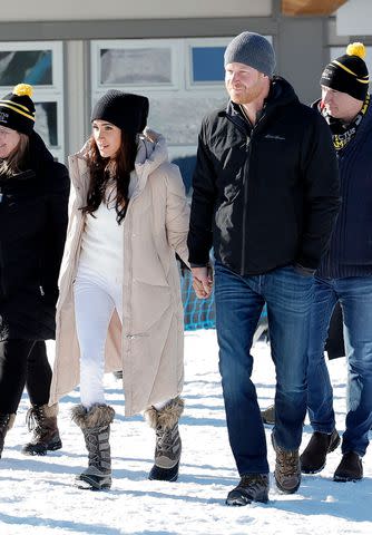 <p>Andrew Chin/Getty</p> Meghan Markle and Prince Harry attend the Invictus Games Winter Training Camp in Canada on Feb. 14, 2024