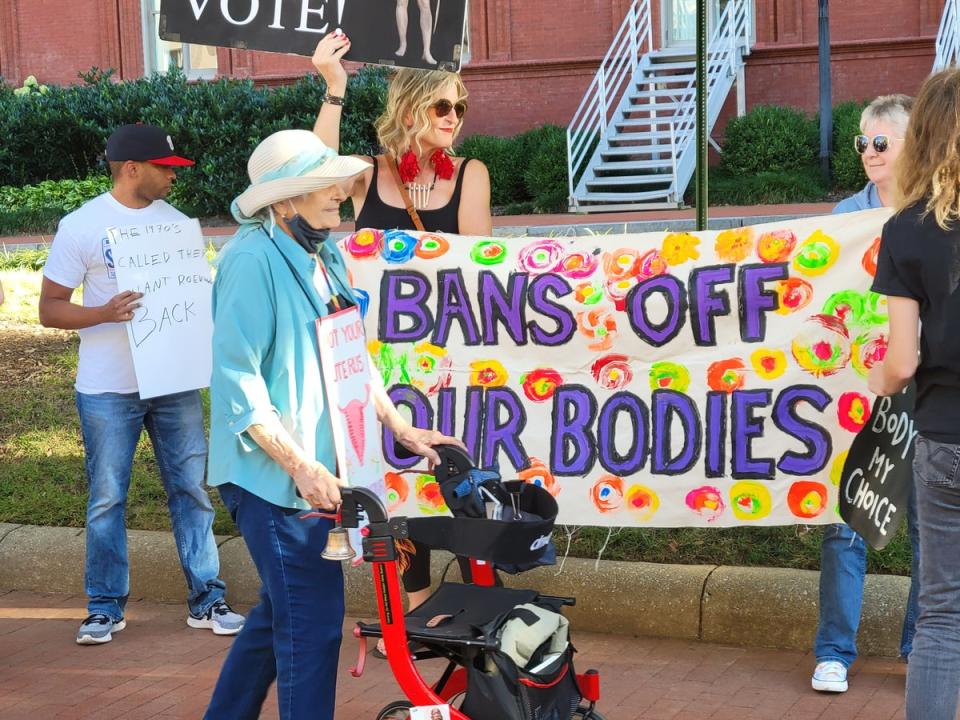 A handful of demonstrators unfurled a banner as a crowd chanted at GOP senators inside the gala (John Bowden)