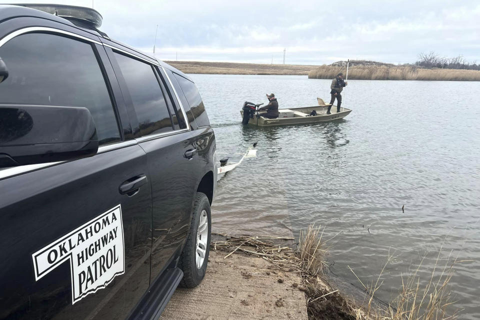 Oklahoma Highway Patrol troopers search a pond near Cyril, Okla, on Jan. 11, 2023, for Athena Brownfield. (Trooper Eric Foster / Oklahoma Highway Patrol via AP)