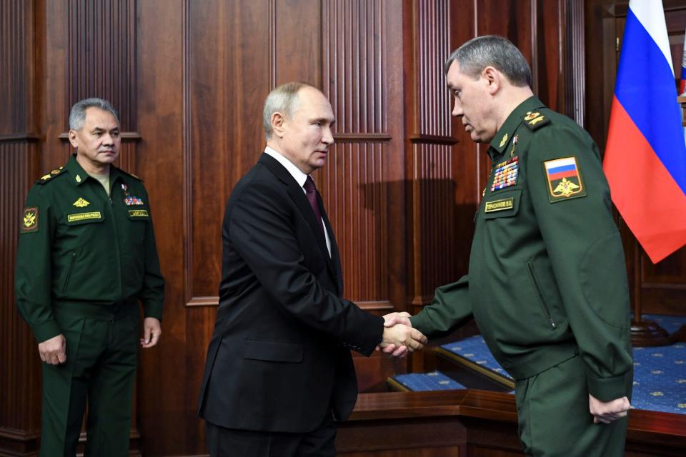 Russian President Vladimir Putin greets Chief of the Russian General Staff Valery Gerasimov in Moscow, Russia, on December 21, 2020.