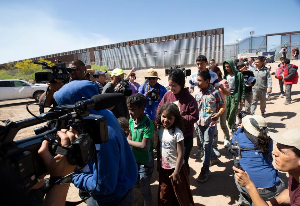Migrants are loaded onto a bus in order to be processed by Customs and Border Protection at gate 42 on Wednesday May 10, 2023 in El Paso, Texas. The migrants had crossed the Rio Grande from Ciudad Juarez, Mexico. 
