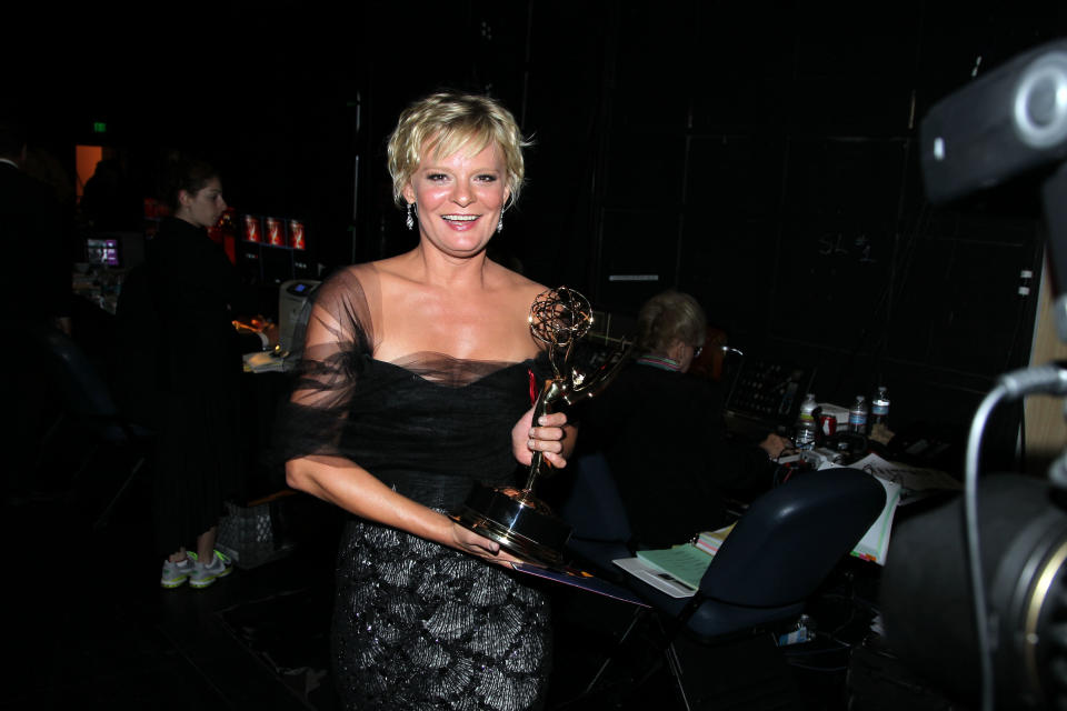 Martha Plimpton poses backstage with her award for outstanding guest actress in a drama series for playing Patti Nyholm on "The Good Wife" at the 2012 Creative Arts Emmys at the Nokia Theatre on Saturday, Sept. 15, 2012, in Los Angeles. (Photo by Matt Sayles/Invision/AP)