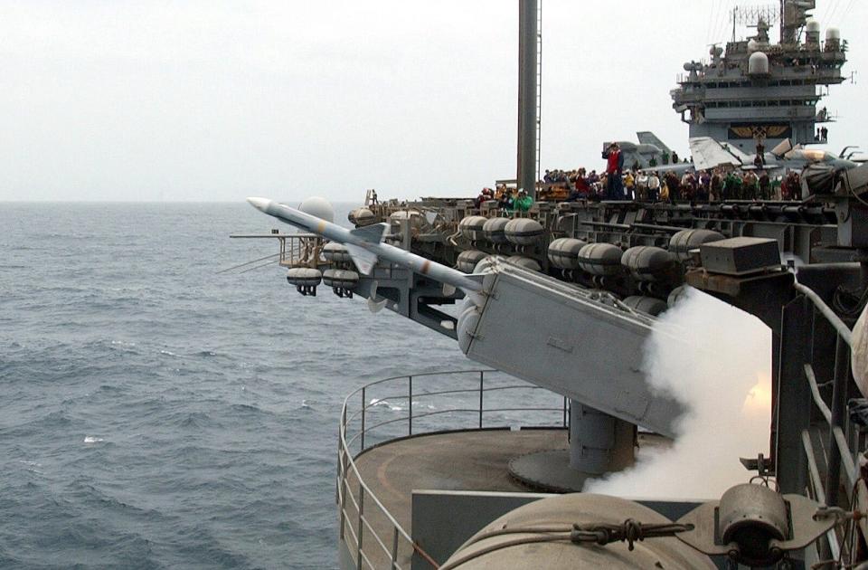 A NATO RIM-7 "Sea Sparrow" missile leaves its launcher during a live fire exercise aboard USS John F. Kennedy.