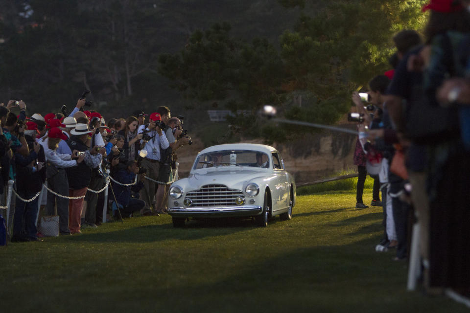 <p>The natural light is barely peeking through on the fairway at Pebble Beach, but a cadre of dedicated (somewhat insane) enthusiasts have already gathered to see the creme-de-la-creme of Monterey Car Week's icons show up. Kicking things off with a bespoke 1950 Ferrari coupe is an auspicious start.</p>