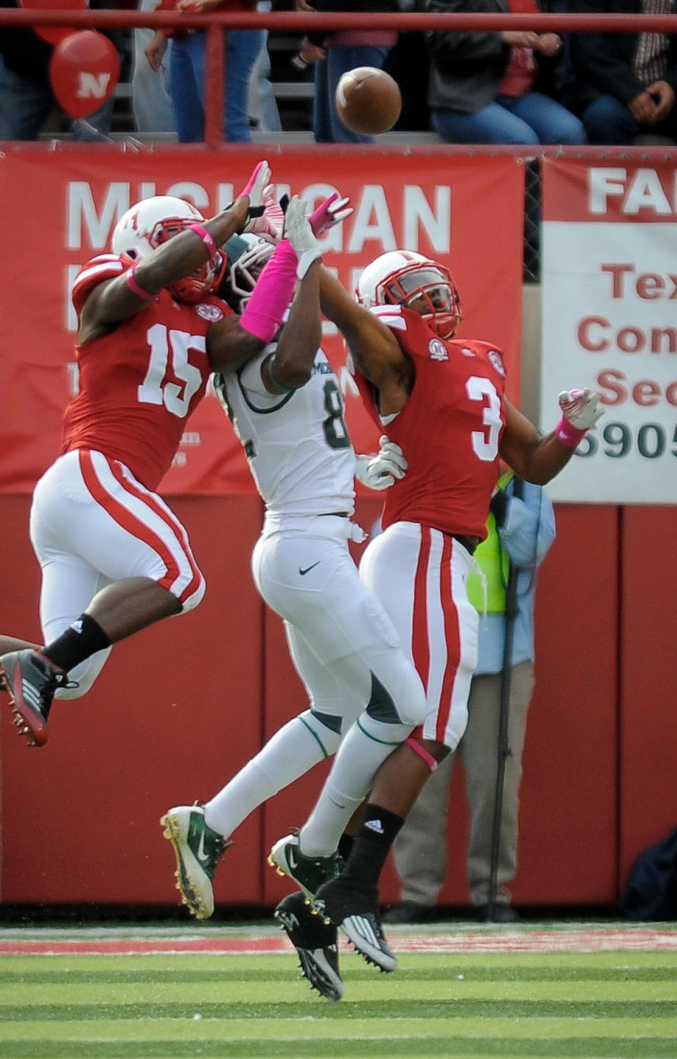 LINCOLN, NE - OCTOBER 29: Safety Daimion Stafford #3 of the Nebraska Cornhuskers and cornerback Alfonzo Dennard #15 of the Nebraska Cornhuskers knock a pass away from wide receiver Keshawn Martin #82 of the Michigan State Spartans during their game at Memorial Stadium October 29, 2011 in Lincoln, Nebraska. (Photo by Eric Francis/Getty Images)