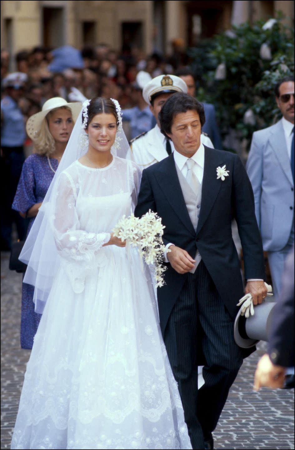 <p>The world waited for a glimpse of the dress the Princess would wear for her 1992 nuptials to Philippe Junot — after all, her mother Grace Kelly's high-neck gown still to this day sways bridal trends. Her sheer embroidered, bell-sleeved gown did not disappoint.</p>