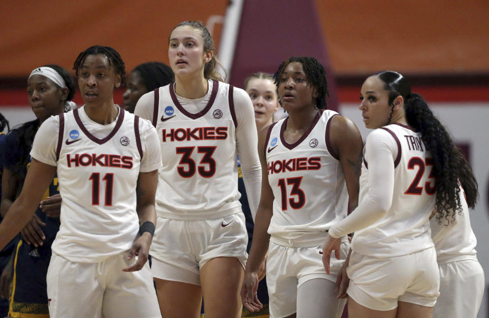 Virginia Tech's D'asia Gregg (11), Elizabeth Kitley (33), Taylor Soule (13) and Kayana Traylor (23) huddle during the second quarter of a first-round college basketball game against Chattanooga in the women's NCAA Tournament, Friday, March 17, 2023, in Blacksburg, Va. (Matt Gentry/The Roanoke Times via AP)
