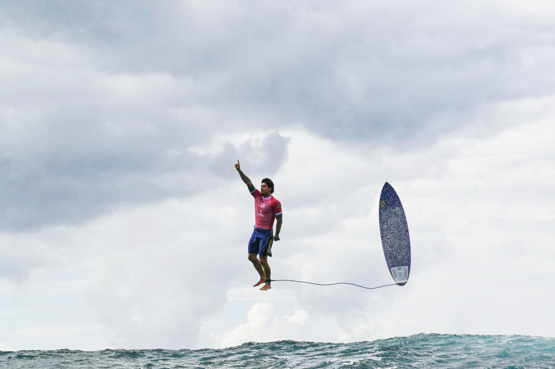 TOPSHOT - Brazil's Gabriel Medina reacts after getting a large wave in the 5th heat of the men's surfing round 3, during the Paris 2024 Olympic Games, in Teahupo'o, on the French Polynesian Island of Tahiti, on July 29, 2024. (Photo by Jerome BROUILLET / AFP) (Photo by JEROME BROUILLET/AFP via Getty Images)