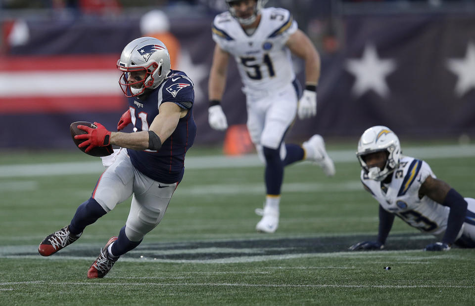 New England Patriots wide receiver Julian Edelman (11) runs after catching a pass against the Los Angeles Chargers during the second half of an NFL divisional playoff football game, Sunday, Jan. 13, 2019, in Foxborough, Mass. (AP Photo/Charles Krupa)