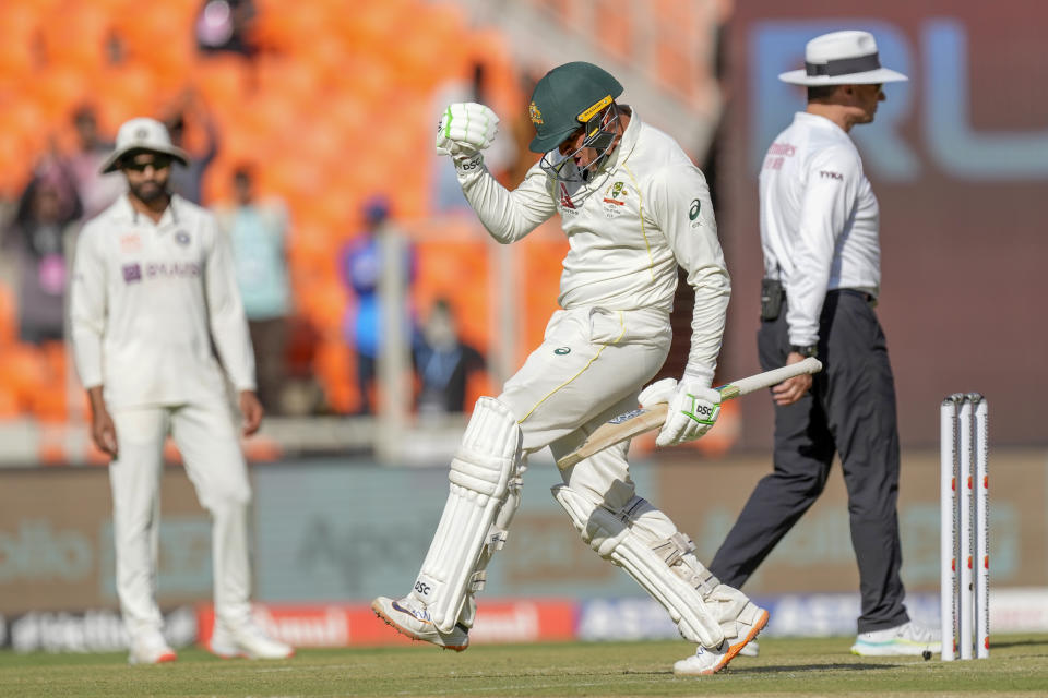 Australia's Usman Khawaja, center, celebrate scoring a century during the first day of the fourth cricket test match between India and Australia in Ahmedabad, India, Thursday, March 9, 2023. (AP Photo/Ajit Solanki)