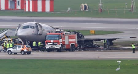 FILE PHOTO: Members of emergency services work at the scene of an incident involving an Aeroflot Sukhoi Superjet 100 passenger plane at Moscow's Sheremetyevo airport