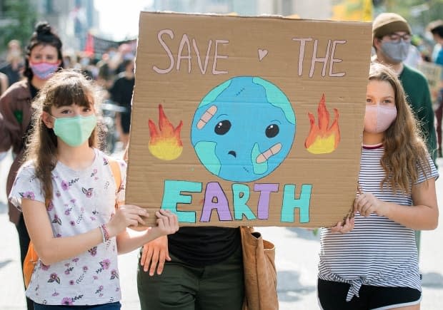 People attend a climate change protest in Montreal on Saturday, September 26, 2020. (Graham Hughes/The Canadian Press - image credit)