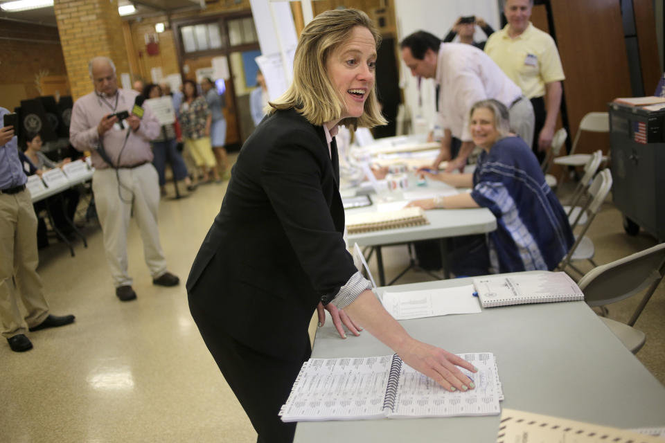 Queens Borough President and candidate for district attorney Melinda Katz talks to poll workers before voting in the Queens borough of New York, Tuesday, June 25, 2019. The race for district attorney of the New York City borough of Queens is shaping up as a battle between moderate Democrats and the left wing of the party. The winner will be strongly favored to win a November general election to succeed the late District Attorney Richard Brown. (AP Photo/Seth Wenig)