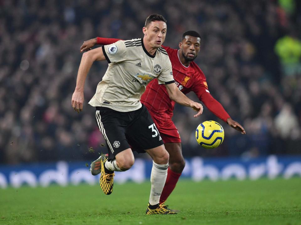 Manchester United's Nemanja Matic takes on Liverpool's Georginio Wijnaldum: AFP via Getty Images