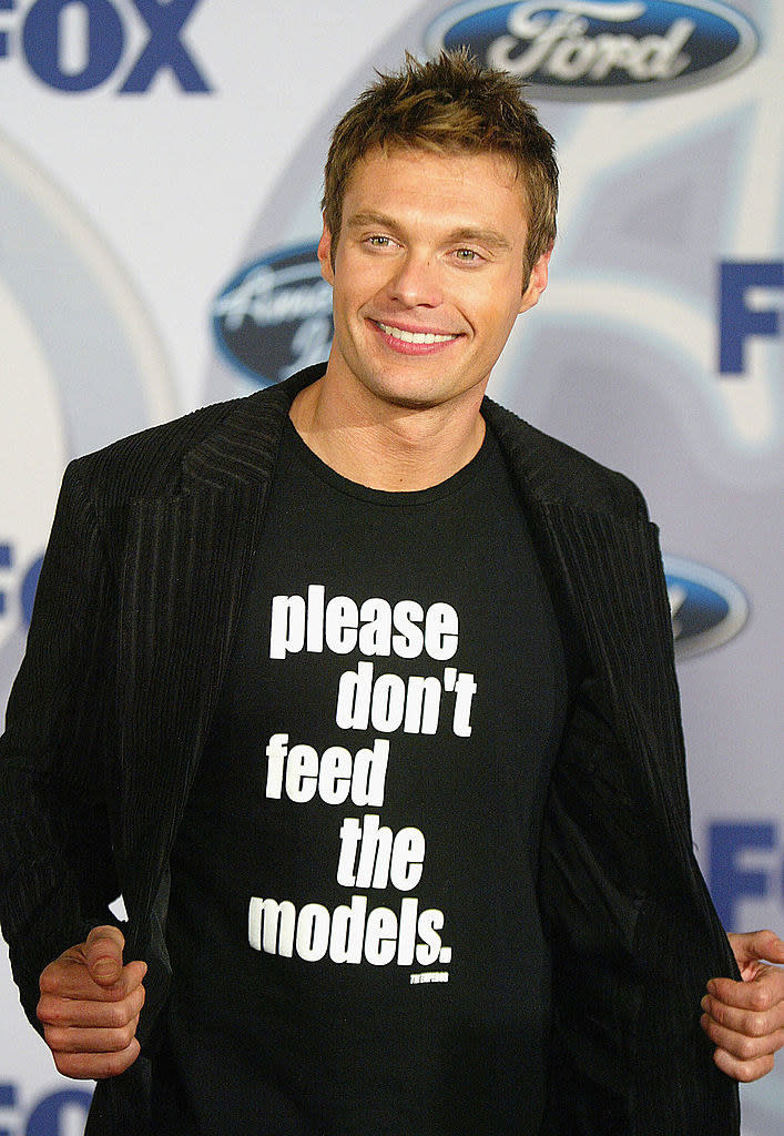 Ryan Seacrest wearing a "Please don't feed the models" shirt