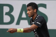 Canada's Felix Auger-Aliassime reacts as he plays Serbia's Filip Krajinovic during their third round match of the French Open tennis tournament at the Roland Garros stadium Friday, May 27, 2022 in Paris. (AP Photo/Michel Euler)