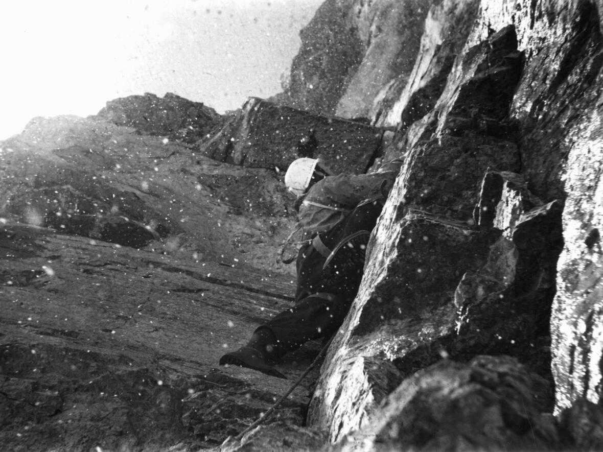Brian Greenwood climbing Mount Yamnuska. The Englishman made a large contribution on climbing Yamnuska in the 1950s and '60s. Archival photos like this one are being used along with interviews videotaped by Chic Scott in the 1990s to bring Canadian mountaineering stories to life. (Photo by Urs Kallen - image credit)