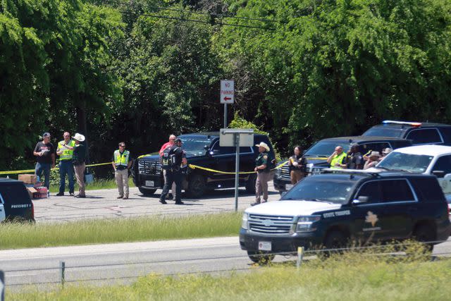 <p>AP Photo/Lekan Oyekanmi</p> First responders arrive at the scene of the crash