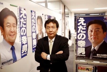 Constitutional Democratic Party of Japan (CDPJ) leader Yukio Edano poses in front of his posters before having an interview with Reuters in Tokyo