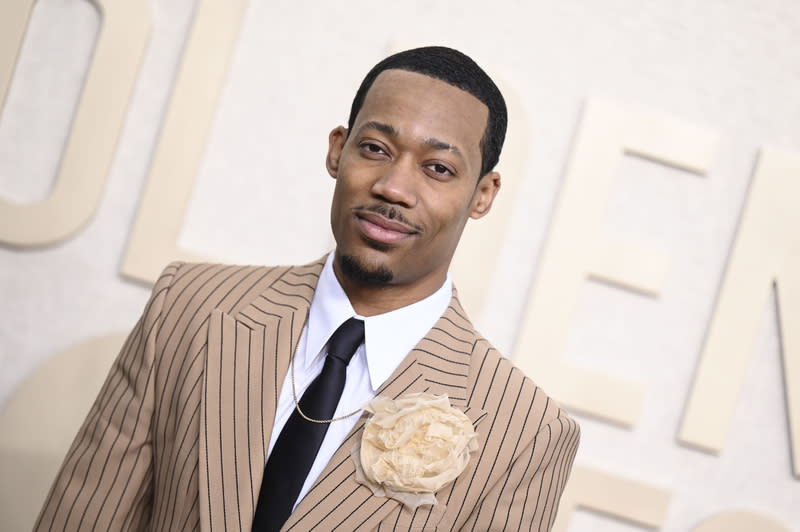 Tyler James Williams Adds Floral Detail To Pin Striped Suit At Golden Globes 2024