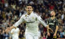 Real Madrid's James Rodriguez celebrates after scoring during the Spanish league match against Malaga at the Santiago Bernabeu stadium on April 18, 2015