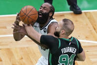 Brooklyn Nets guard James Harden (13) loses control of the ball as Boston Celtics guard Evan Fournier (94) defends during the first quarter of Game 3 in an NBA basketball first-round playoff series, Friday, May 28, 2021, in Boston. (AP Photo/Elise Amendola)