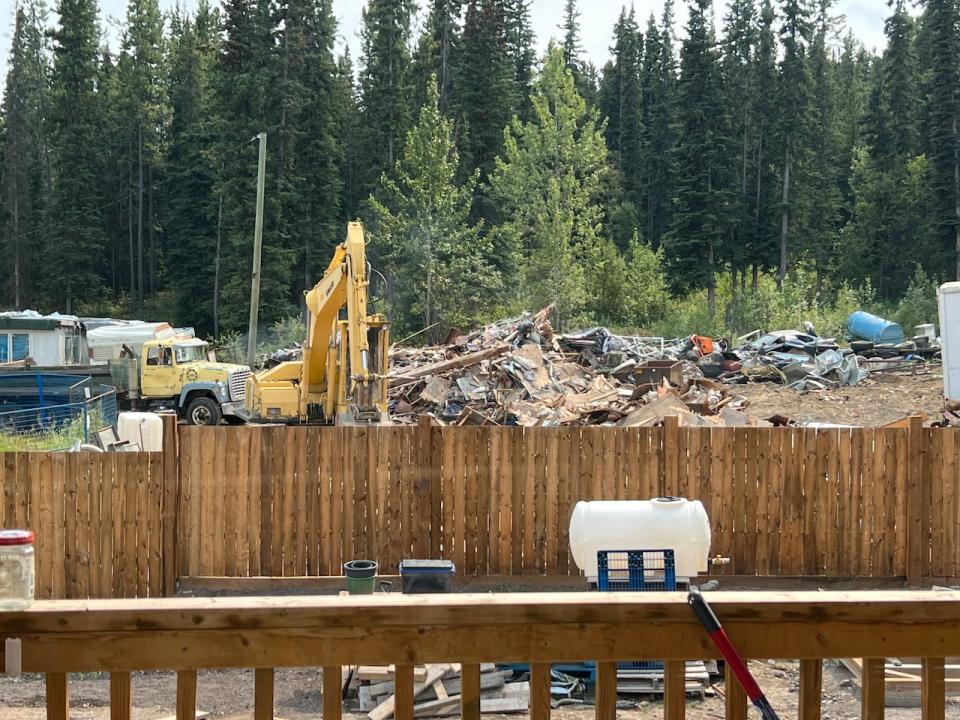 Heavy equipment and debris are visible on a longstanding polluted site on Lodgepole Lane, near the Porter Creek neighbourhood in Whitehorse. (Kimpton Gagnon - image credit)