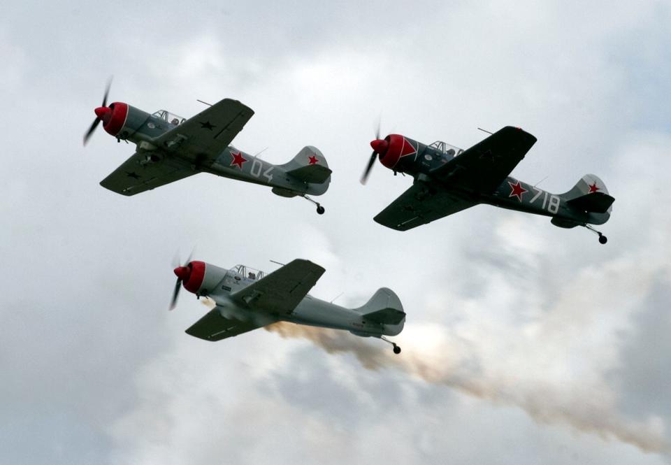 Team Aerostars perform in their Yak-52 aircraft during a daily air show at Sun 'n Fun in 2013.