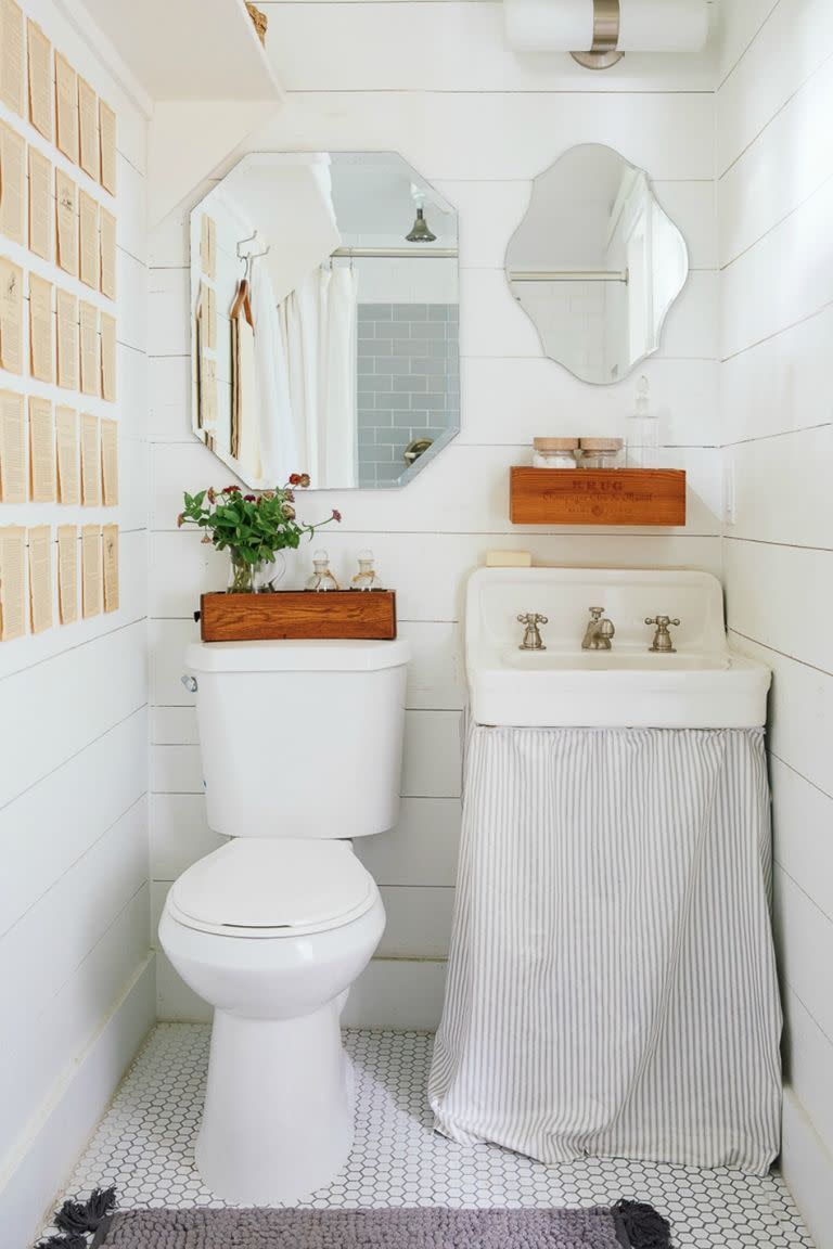 small bathroom storage ideas, skirt under the white sink in the powder room