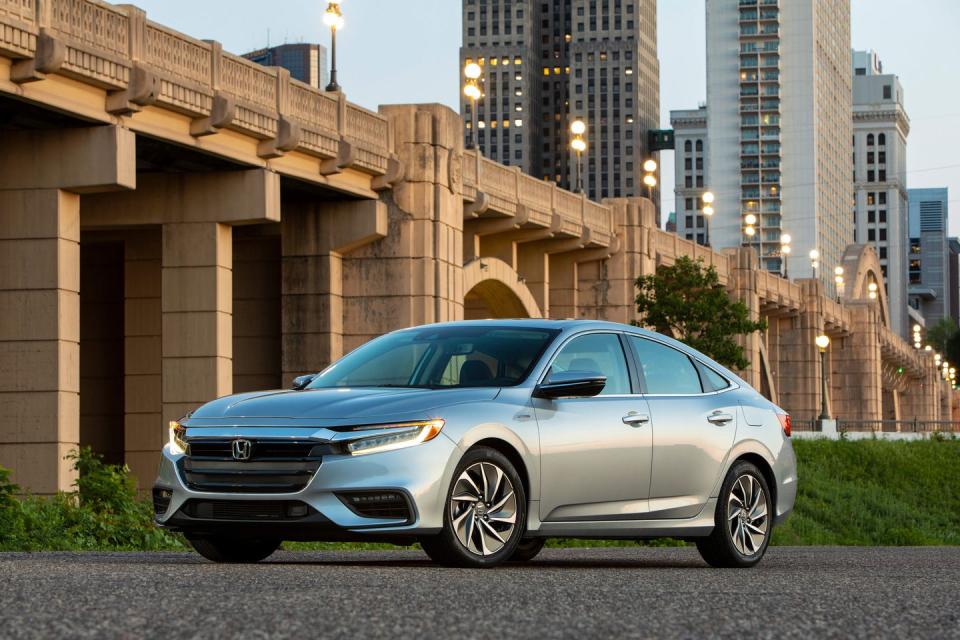 <p>The 2022 Honda Insight is the spiritual successor to the Civic hybrid. With a similar size and shape as Honda's compact sedan but an <a href="https://www.caranddriver.com/reviews/a26287347/2019-honda-insight-reliability-maintenance/" rel="nofollow noopener" target="_blank" data-ylk="slk:efficient gas-electric powertrain;elm:context_link;itc:0;sec:content-canvas" class="link ">efficient gas-electric powertrain</a> under the hood, the Insight is like a <a href="https://www.caranddriver.com/reviews/a26287347/2019-honda-insight-reliability-maintenance/" rel="nofollow noopener" target="_blank" data-ylk="slk:Civic;elm:context_link;itc:0;sec:content-canvas" class="link ">Civic</a> that’s quieter at low speeds and delivers better mpg. Many of the Civic's best aspects are present here, including a comfortable ride, a pleasant interior, and accurate steering. You'll make a slight sacrifice in acceleration, and the Insight can get noisy when you step on it, but it's a pleasant-looking sedan that doesn't cost more than non-hybrid rivals and will save you money at the pump.<br></p><p><a class="link " href="https://www.caranddriver.com/honda/insight" rel="nofollow noopener" target="_blank" data-ylk="slk:Review, Pricing, and Specs;elm:context_link;itc:0;sec:content-canvas">Review, Pricing, and Specs</a></p>